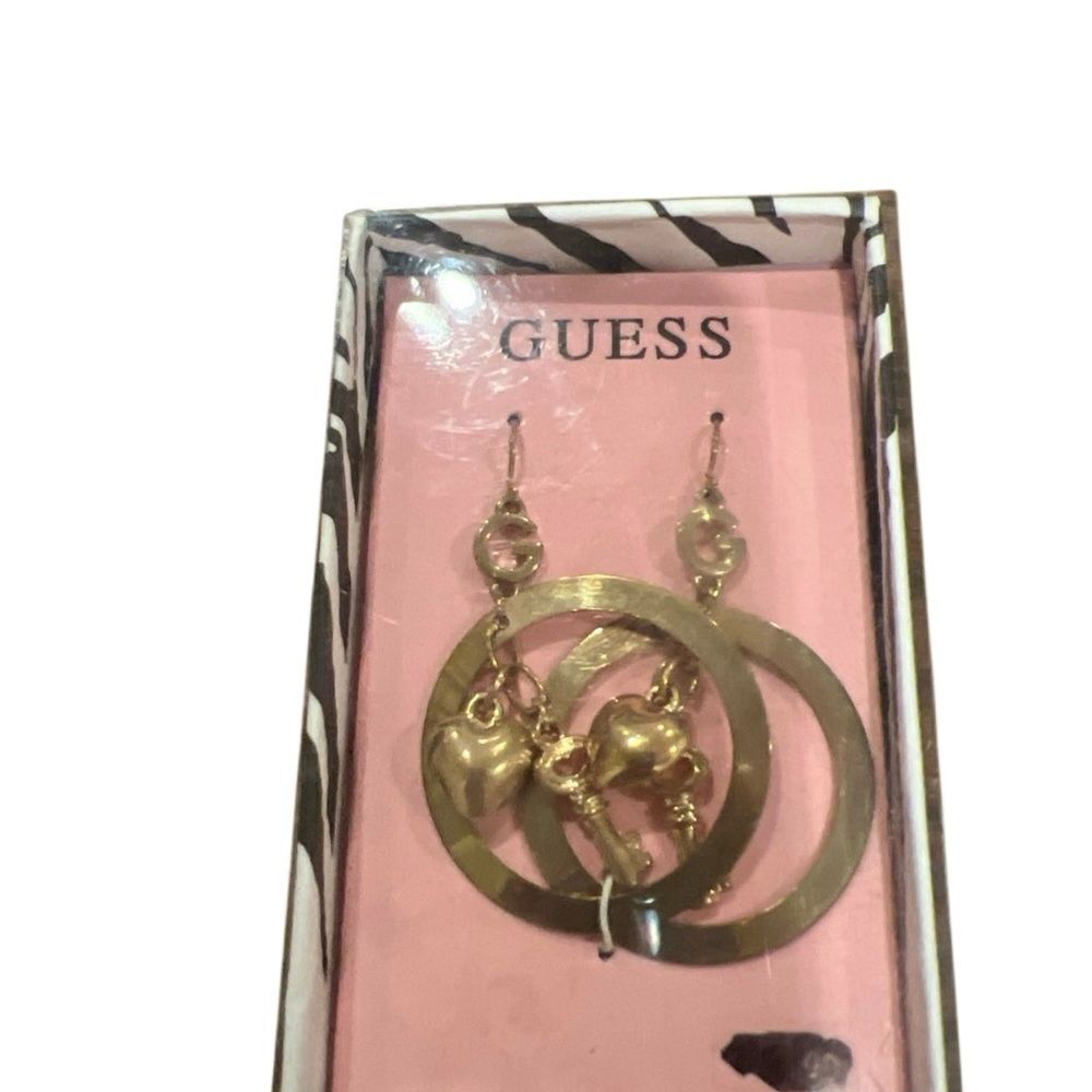 Guess Gold Tone Heart Dangle Earrings